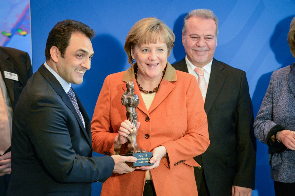 The award is presented to Chancellor Angela Merkel.