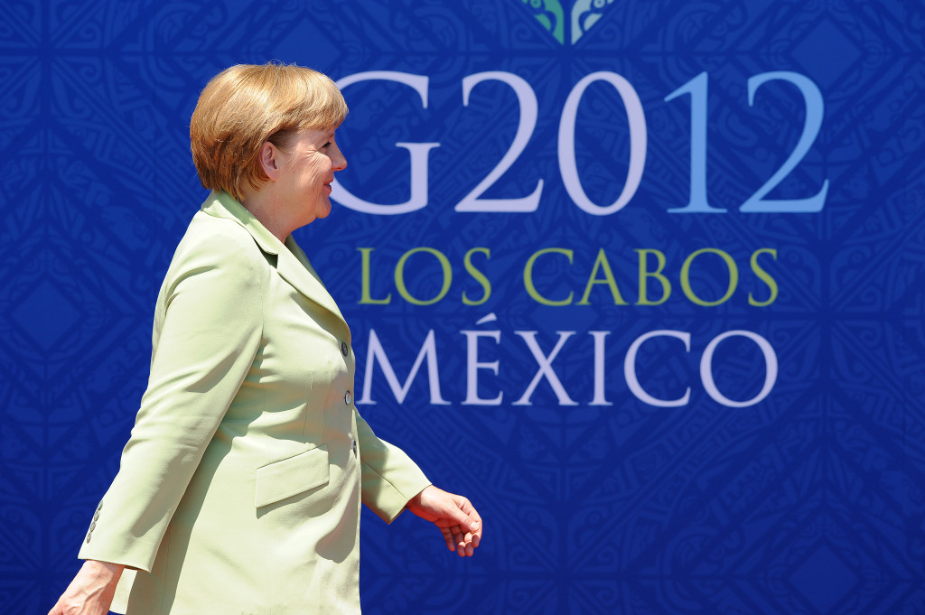 Chancellor Angela Merkel in front of the logo of the Mexican G20 summit