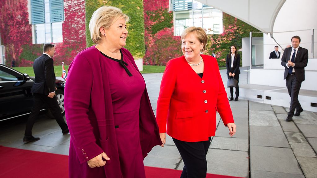 Chancellor Angela Merkel greets Erna Solberg, Norway's Prime Minister, at the Federal Chancellery.