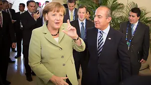 The Mexican President, Felipe Calderon, welcomes the Chancellor.