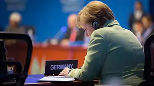 Chancellor Angela Merkel at the conference table