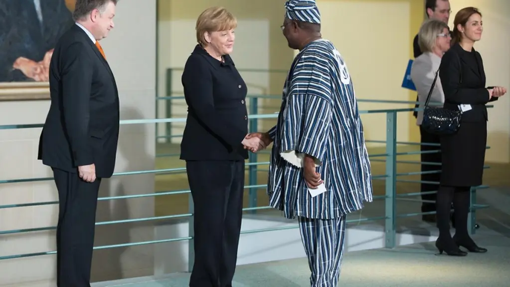Angela Merkel welcomes the Ambassador of Ghana, Paul King Aryene.