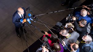 Federal Chancellor Scholz delivering a press statement at the Council of Europe Summit.