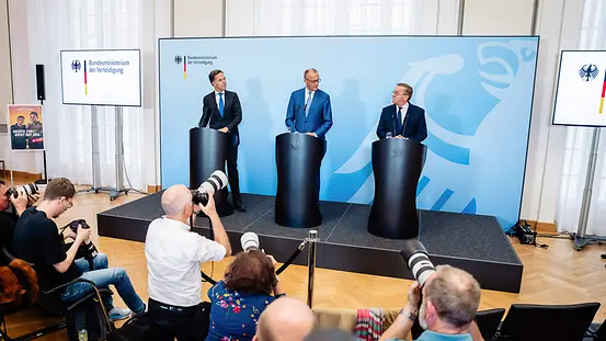 Federal Chancellor Friedrich Merz speaks between NATO Secretary General Mark Rutte and Boris Pistorius, Federal Minister of Defence, at a press conference.