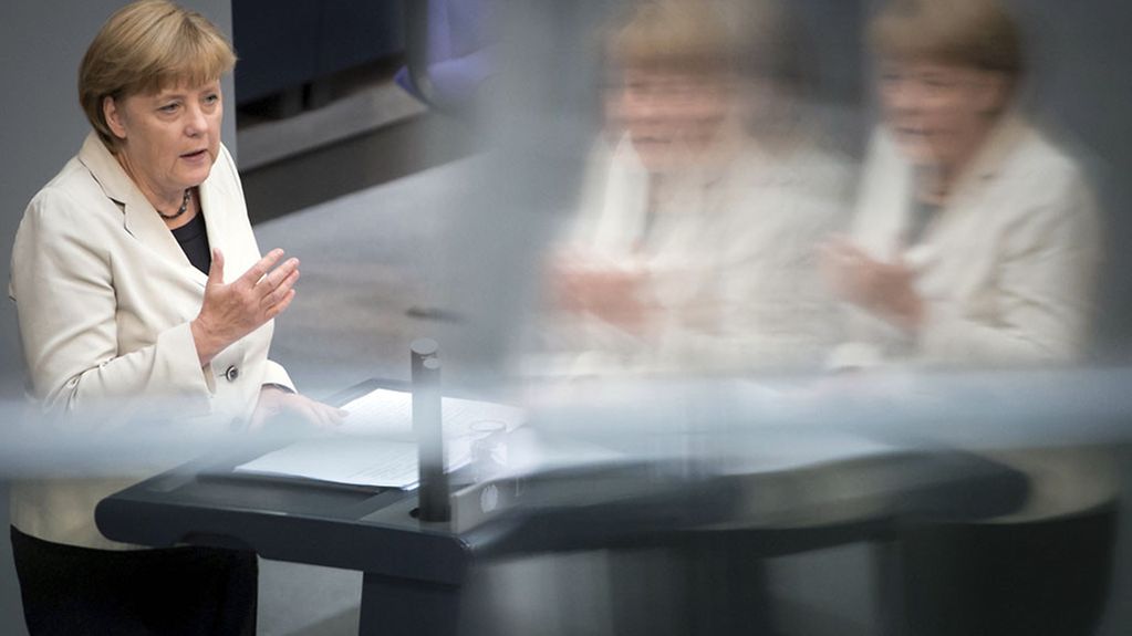 Chancellor Angela Merkel at the lectern