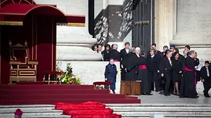 Chancellor Angela Merkel is welcomed by Vatican officials.