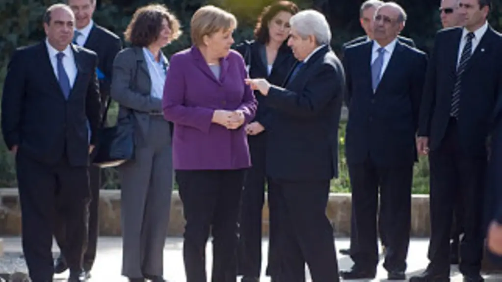 Chancellor Angela Merkel and President Dimitris Christofias deep in discussion