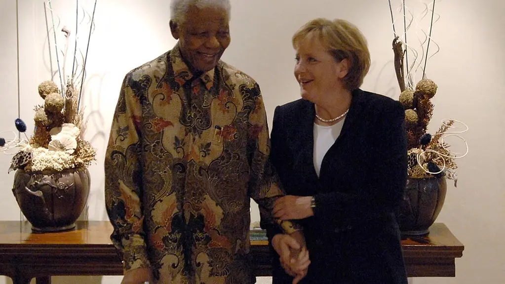 Nelson Mandela and Angela Merkel