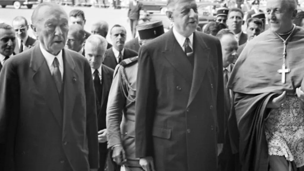 Federal Chancellor Konrad Adenauer and French President Charles de Gaulle in front of Notre-Dame de Reims Cathedral.