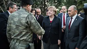 Chancellor Angela Merkel is greeted by the Turkish commanding officer Colonel Kazaz at the Kahramanmaras Base.