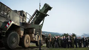 Chancellor Angela Merkel beside a Patriot System installed for inspection.