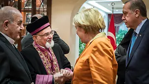 Angela Merkel and the Turkish Prime Minister Recep Tayyip Erdogan during their meeting with representatives of Turkish religious communities at the Prime Minister's residence