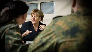 Chancellor Angela Merkel talks to German soldiers from the Patriot Unit stationed in Kahramanmaras.