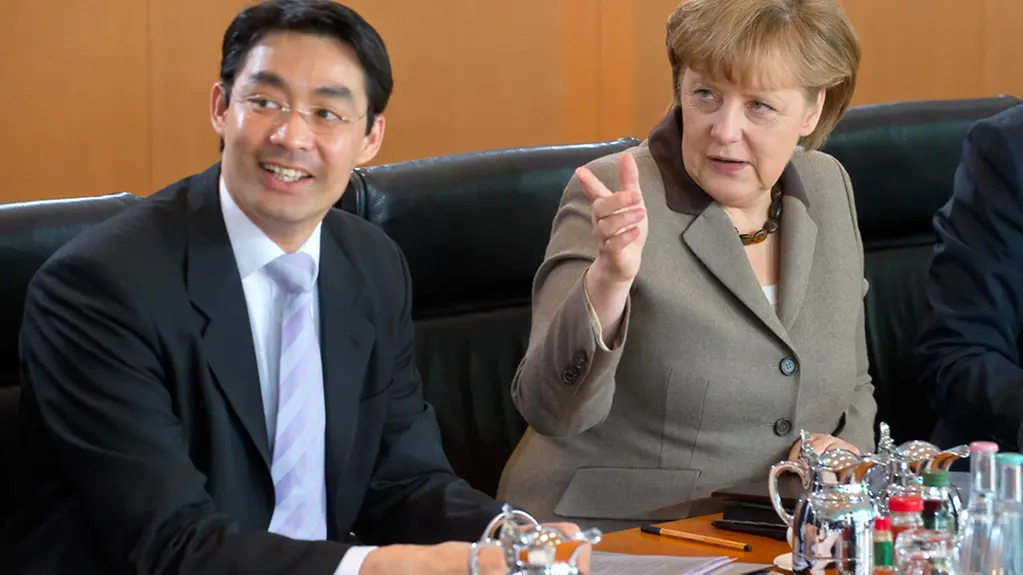 Chancellor Angela Merkel and Vice-Chancellor Philipp Rösler at the Cabinet table.