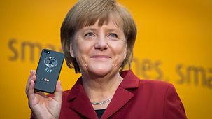 Angela Merkel with the secure mobile phone