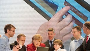 Angela Merkel and Donald Tusk with a tablet