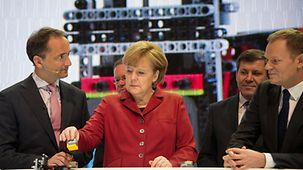 Angela Merkel with a Lego component